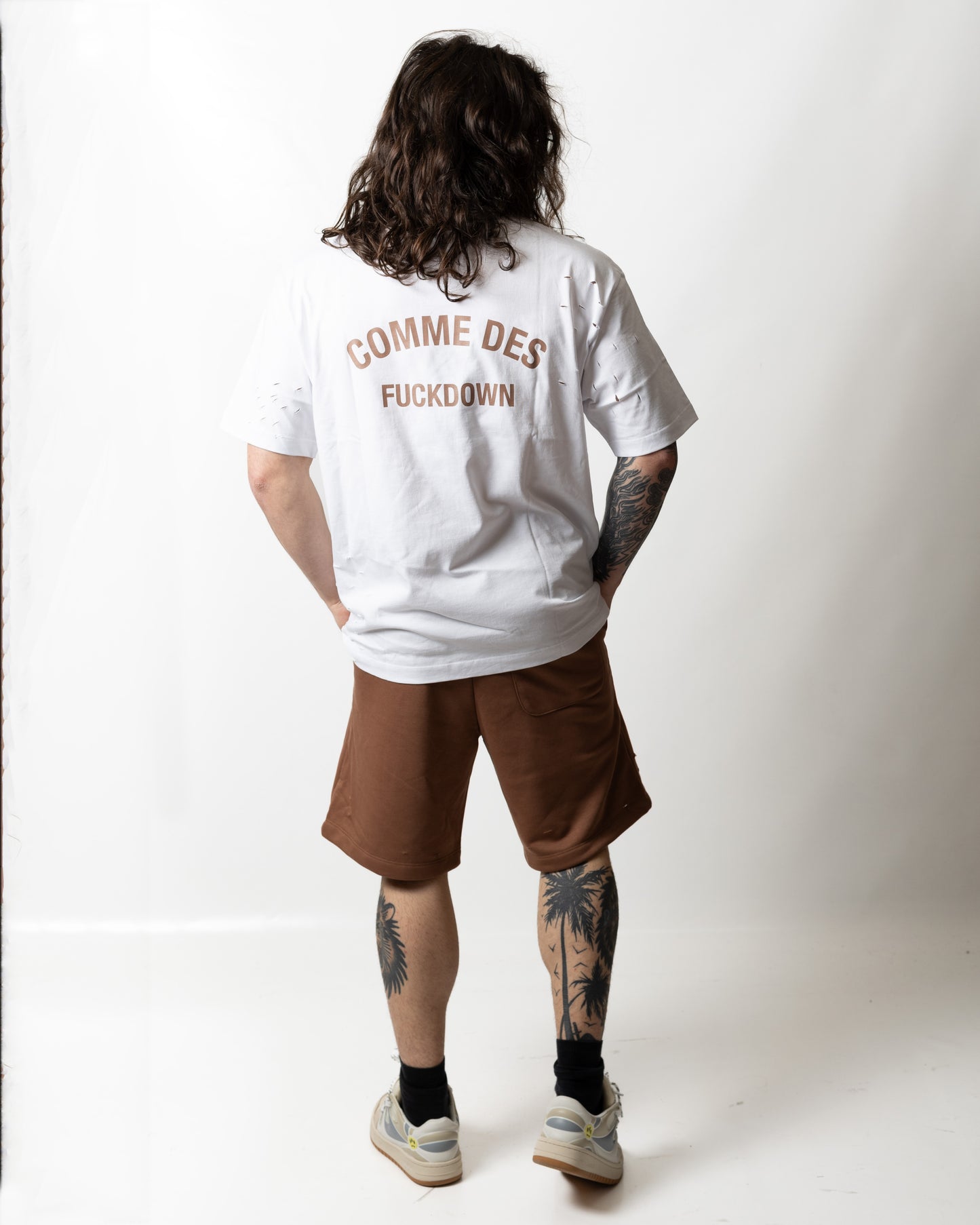 Bermuda Comme des Fuckdown in felpa con tagli e logo uomo