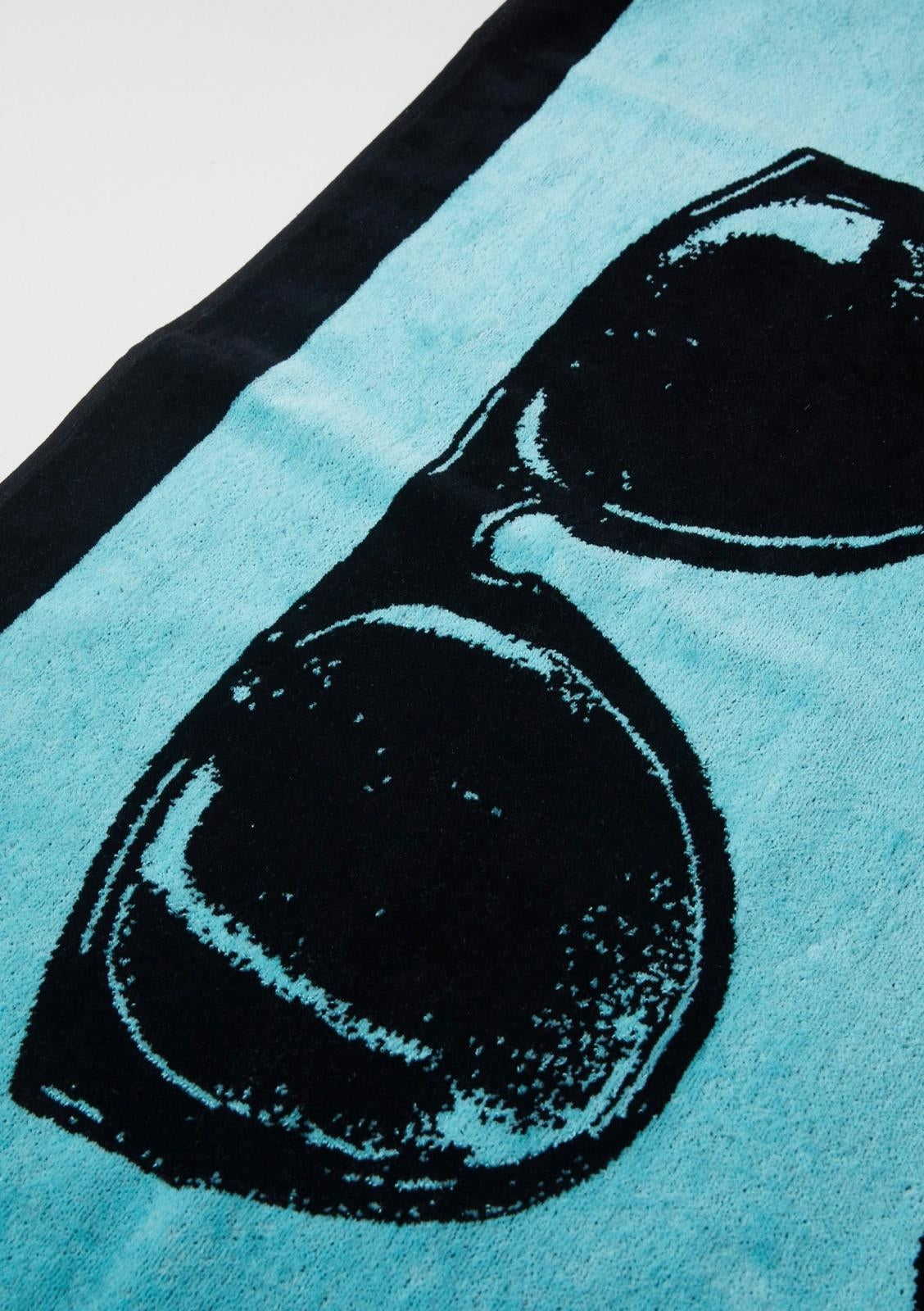Telo mare Moschino Beachwear con logo e grafica a contrasto