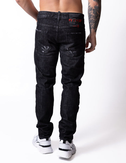 Jeans G2Firenze con rotture e patch logo con applicazione metallica