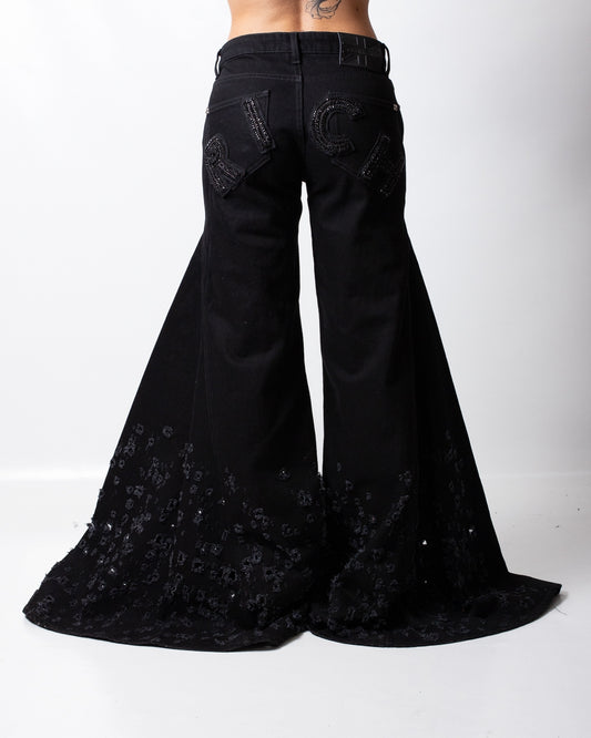 Jeans John Richmond a gamba larga con strappi e logo patch donna
