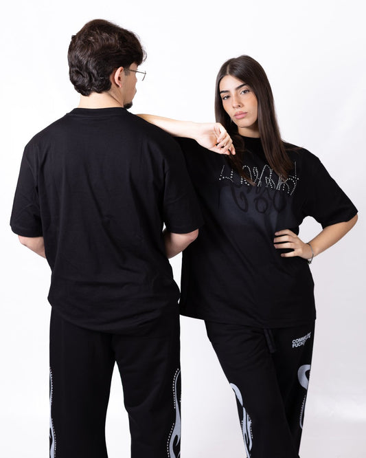 T-shirt Comme des Fuckdown con borchie e stampa