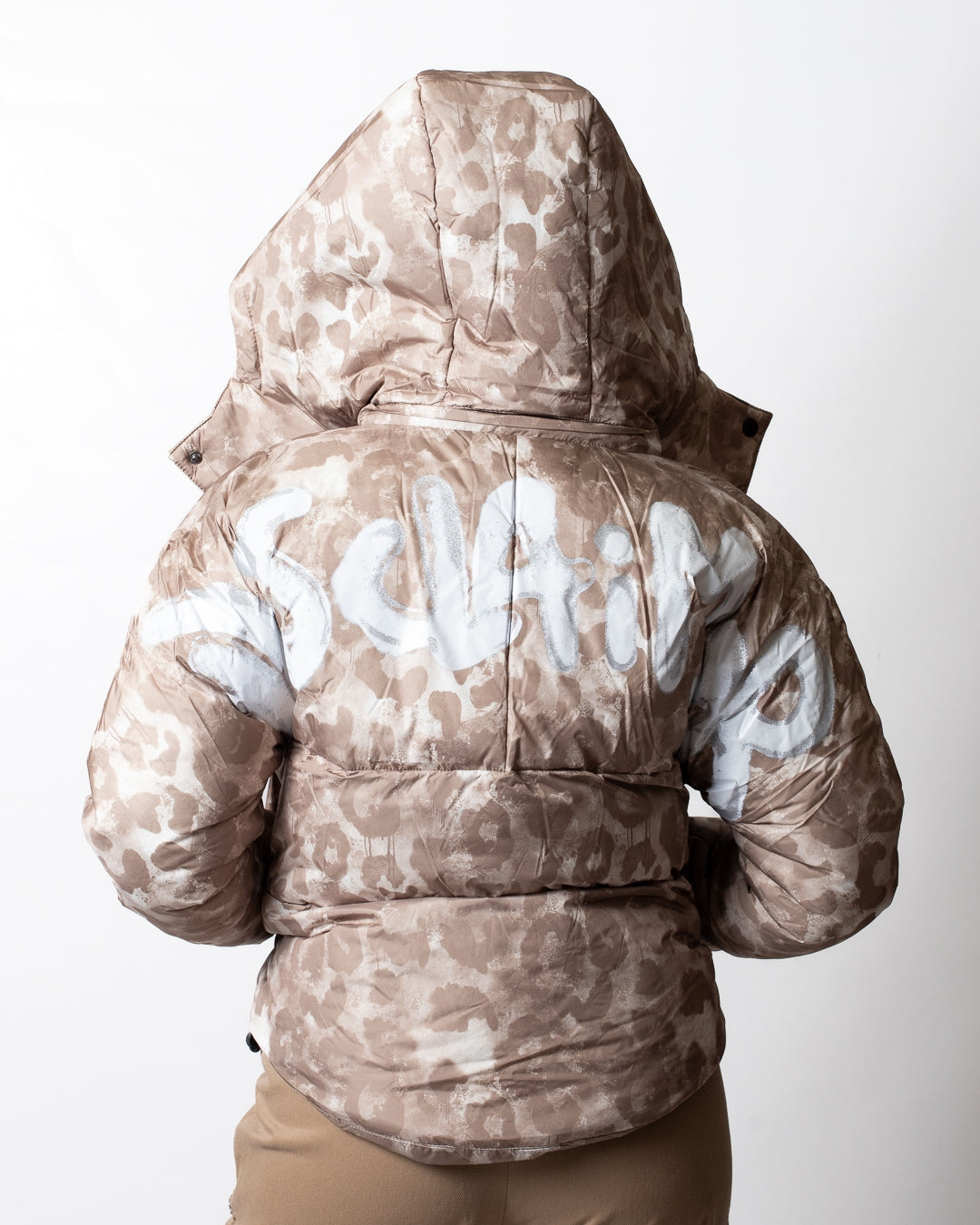Piumino Disclaimer puffer maculato con cappuccio donna