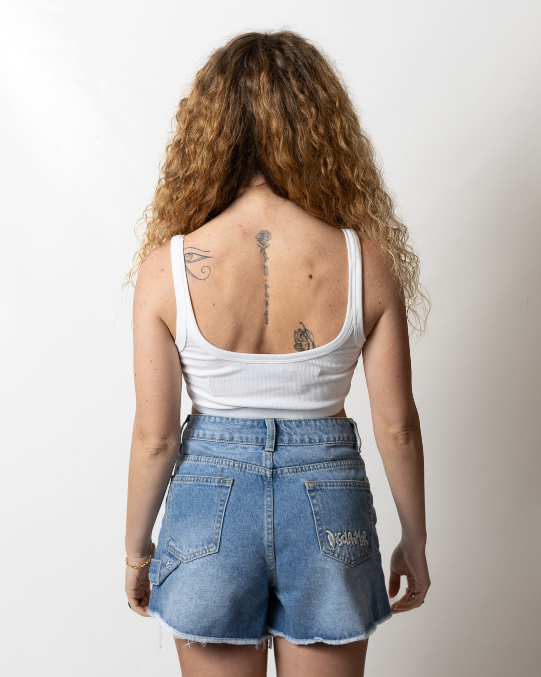 Top Disclaimer cropped in costina con strass donna