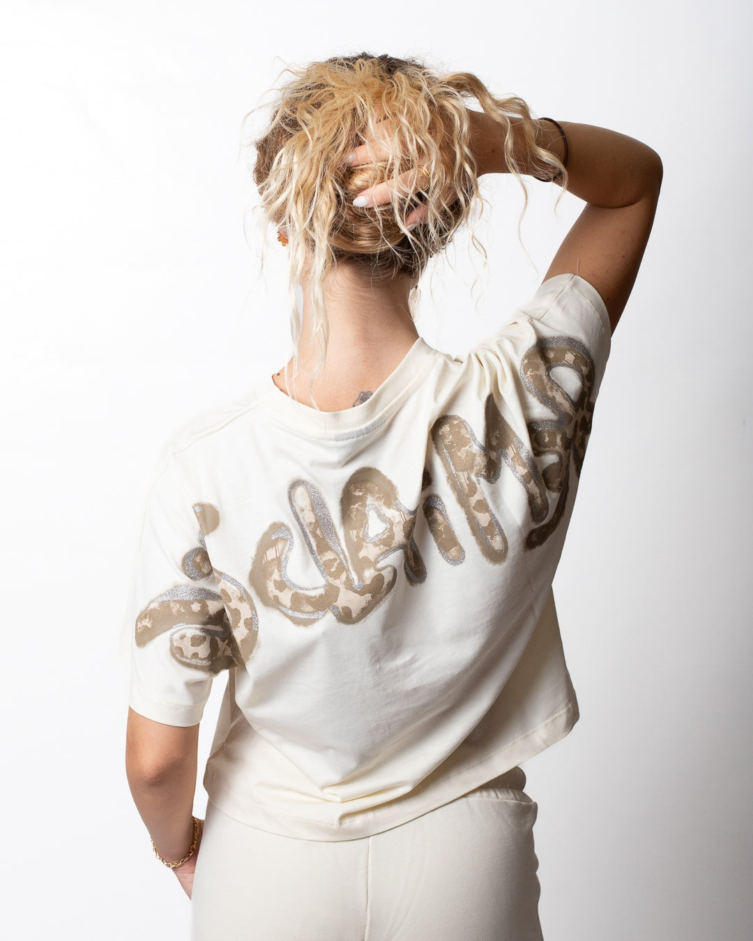T-Shirt Disclaimer cropped con logo maculato donna