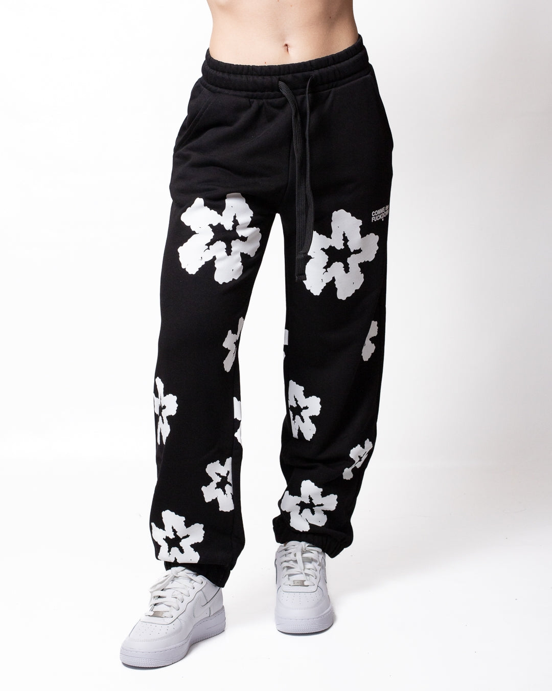 Pantalone Comme des Fuckdown in felpa con fiori all-over donna