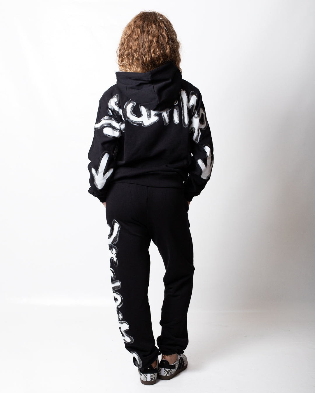 Pantalone Disclaimer in felpa con logo glitterato donna