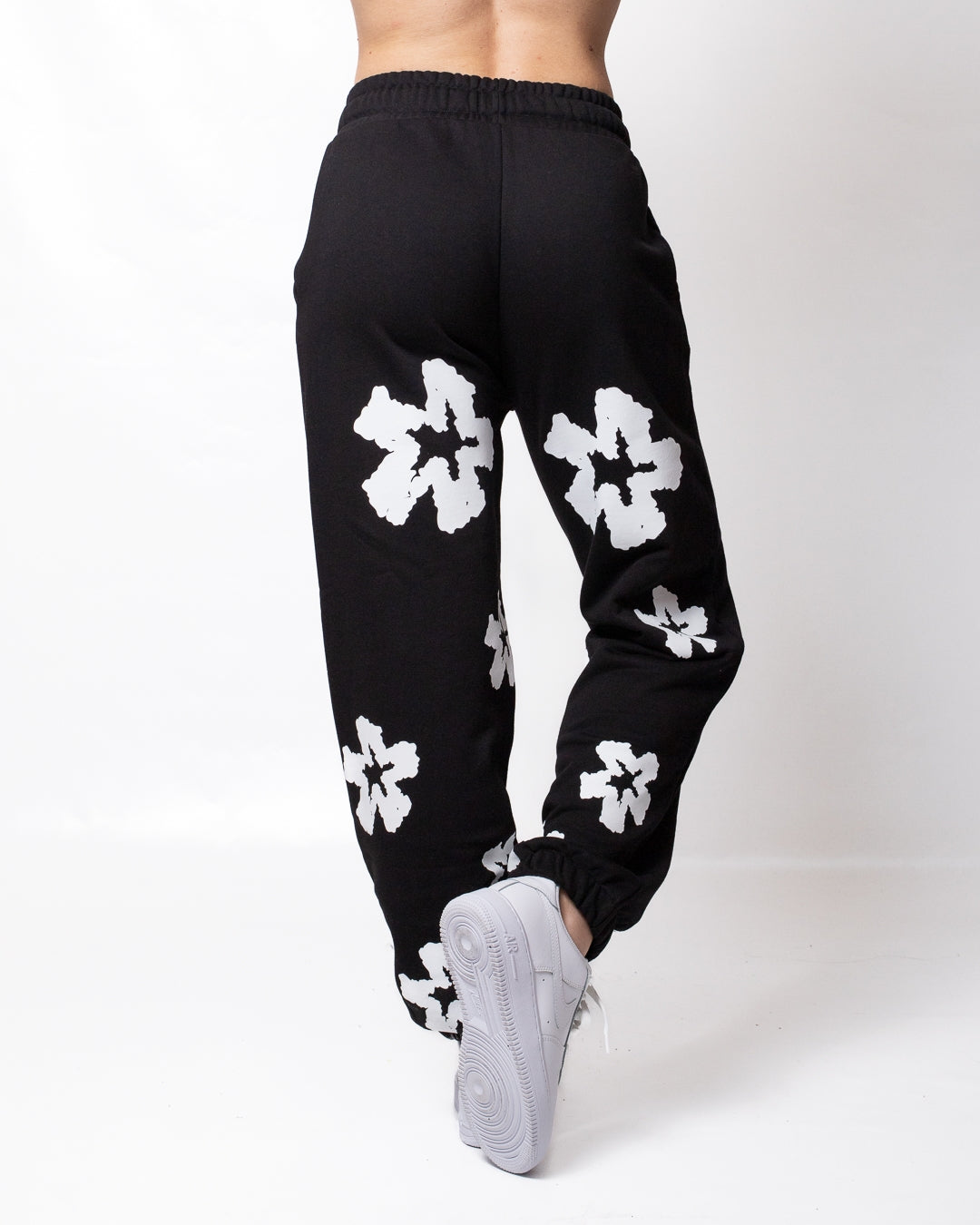 Pantalone Comme des Fuckdown in felpa con fiori all-over donna