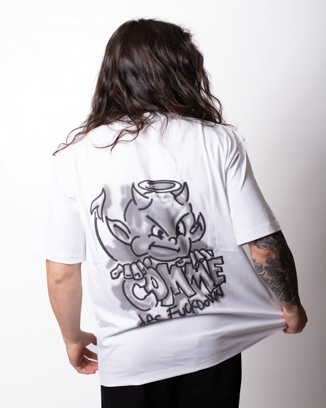 T-Shirt Comme des Fuckdown con stampa spray uomo