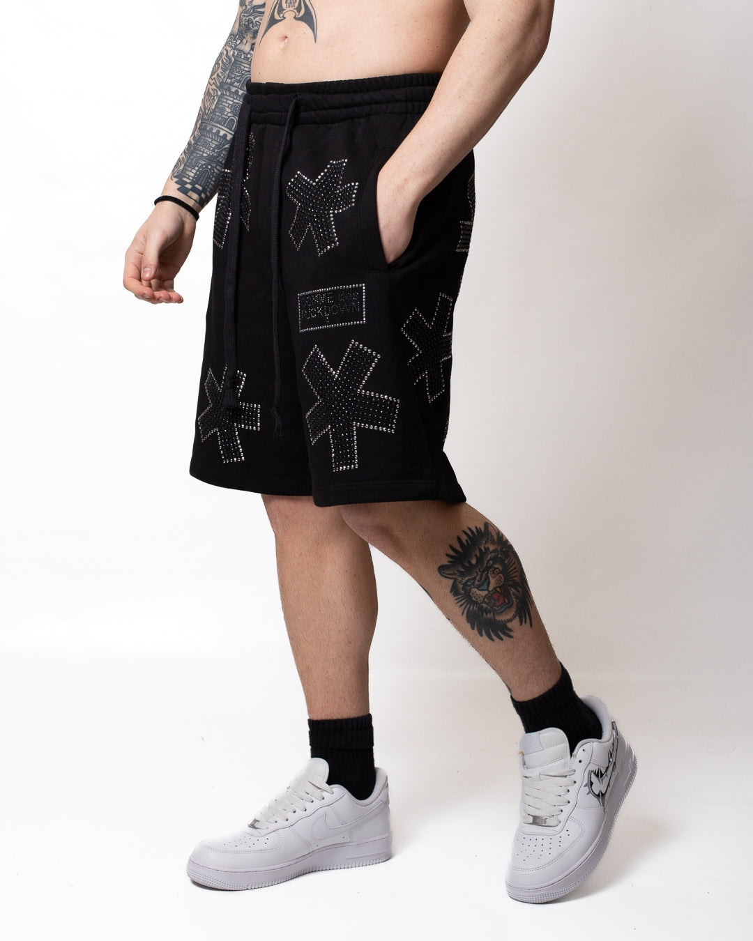 Bermuda Comme des Fuckdown in felpa con strass all-over uomo