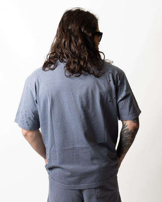 T-Shirt Comme des Fuckdown logata con strappi uomo
