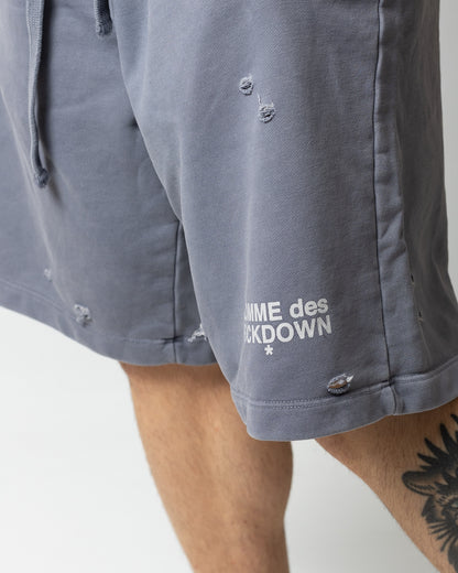 Bermuda Comme des Fuckdown in felpa logata con tagli uomo