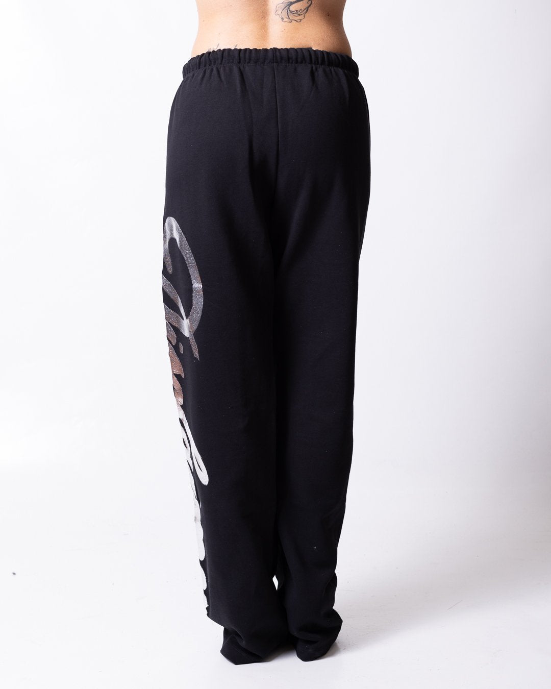 Pantalone Disclaimer con grafica "Disclaimer" stampata