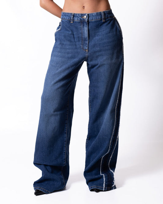 Jeans Palm Angels a palazzo con dettagli taglio vivo e logo patch