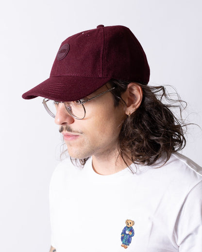 Cappello Colmar in lana con visiera e logo in rilievo