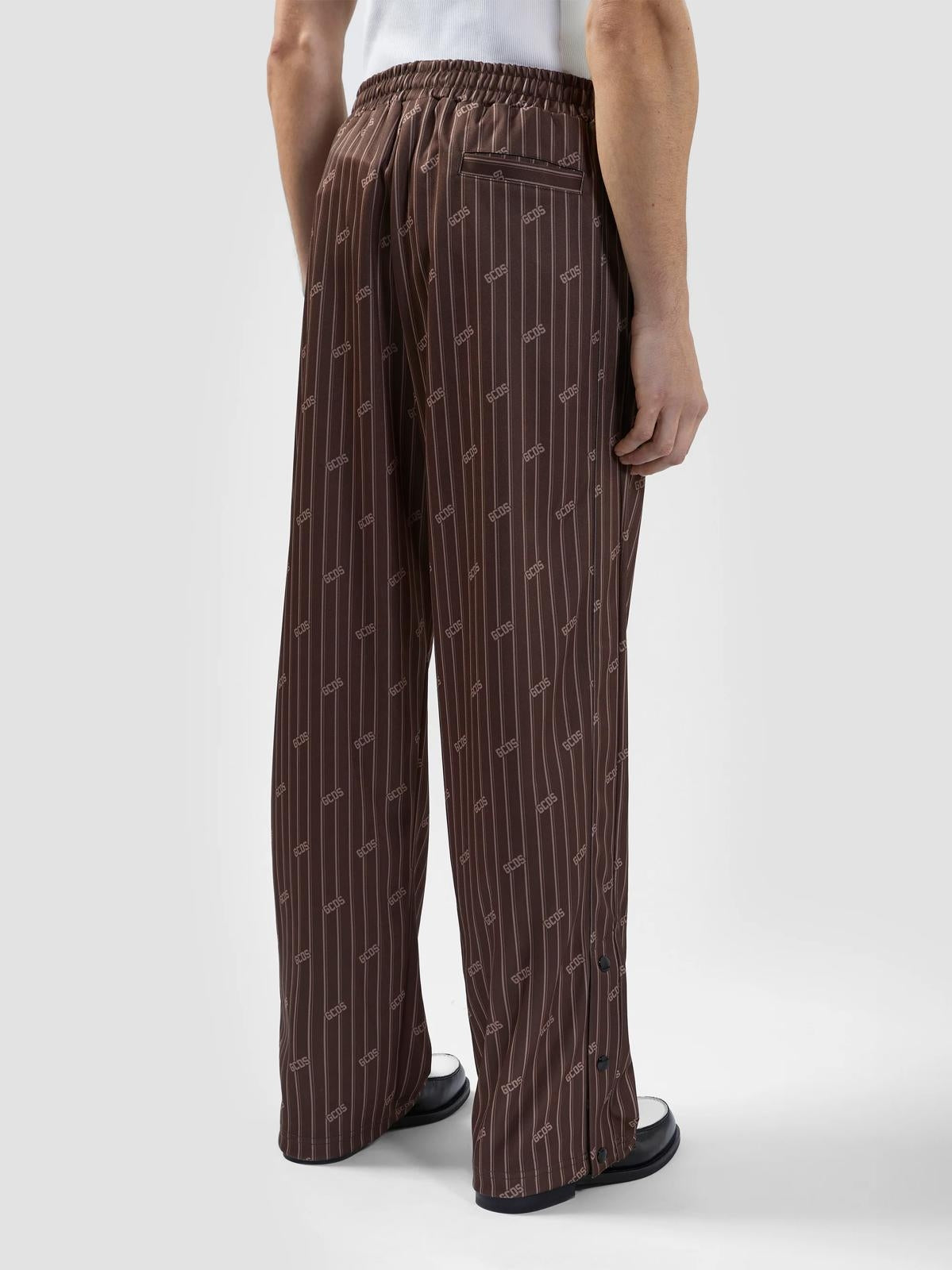 Pantalone GCDS in acetato con logo all-over uomo