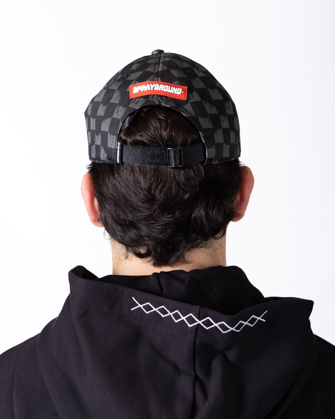 Cappello Sprayground con visiera e logo in pelle ricamato