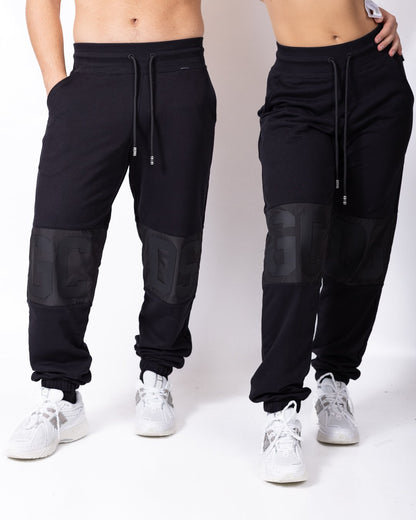Pantalone GCDS mix di tessuti con logo gommato in rilievo