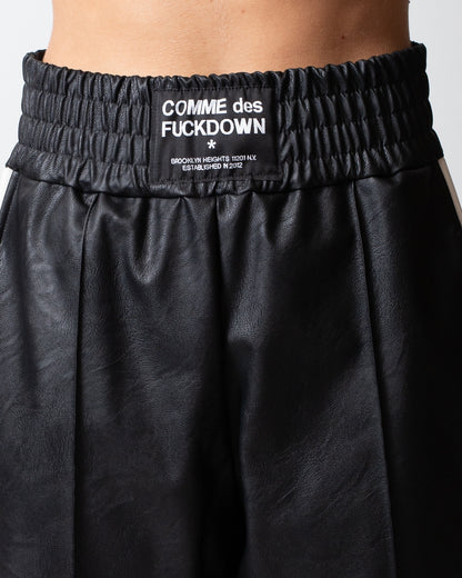 Pantalone Comme des Fuckdown in pelle con patch donna