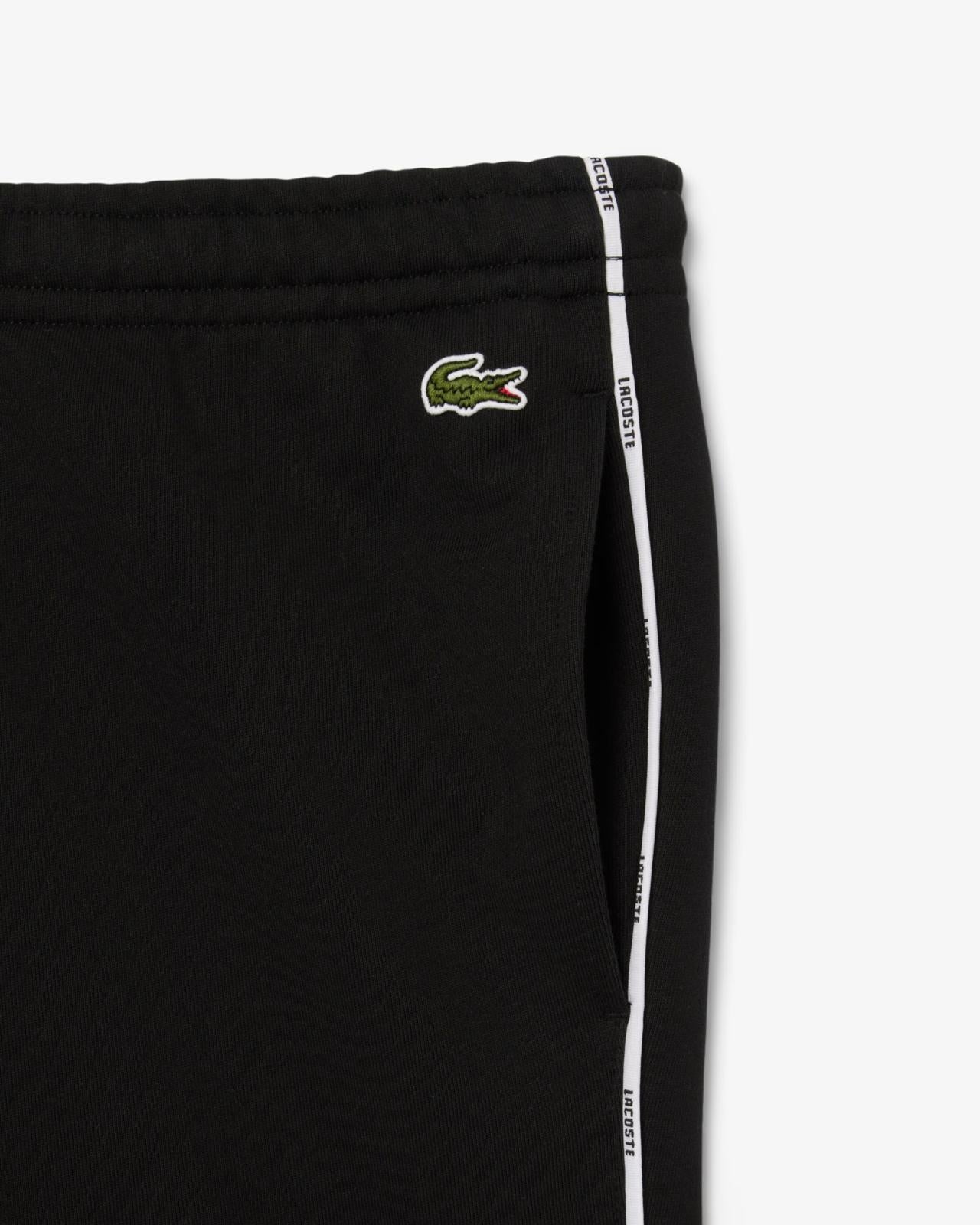 Pantalone Lacoste con logo firmato lungo la gamba uomo