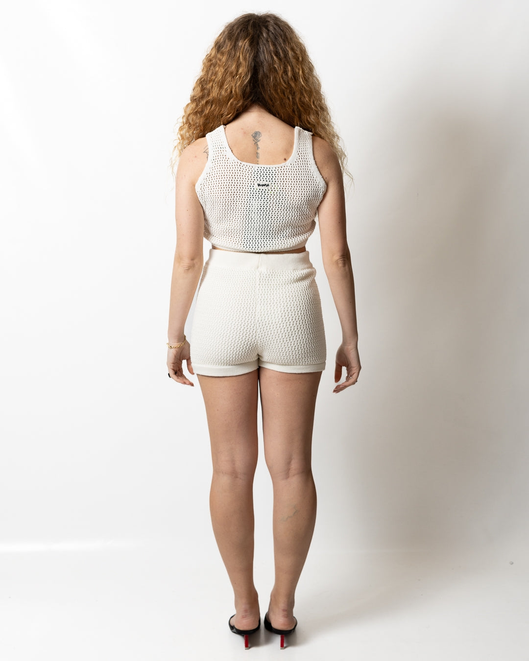 Top Disclaimer cropped in maglia traforata donna