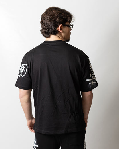 T-Shirt Comme des Fuckdown con stampa spray uomo