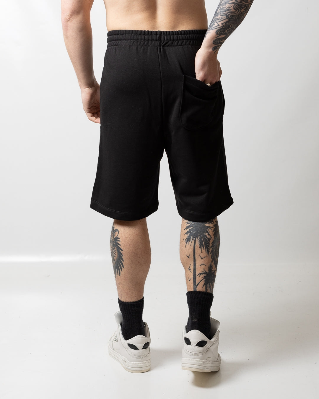 Bermuda Comme des Fuckdown in felpa con borchie uomo