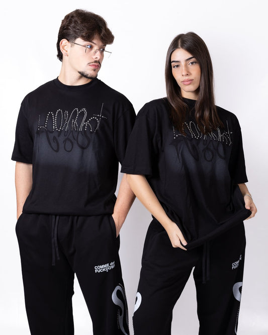 T-shirt Comme des Fuckdown con borchie e stampa
