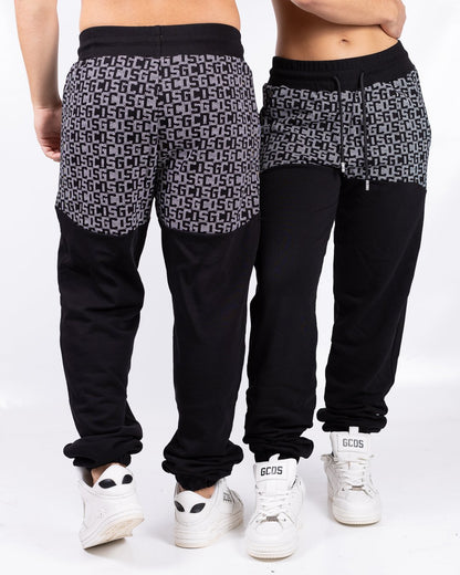Pantalone GCDS con logo allover a contrasto 