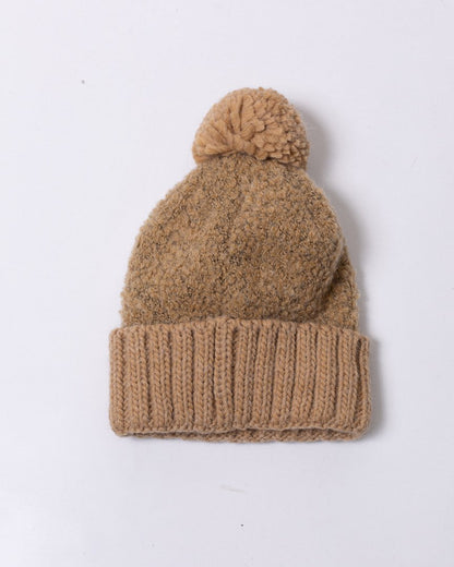 Cappello Colmar in filato bouclè con pompon