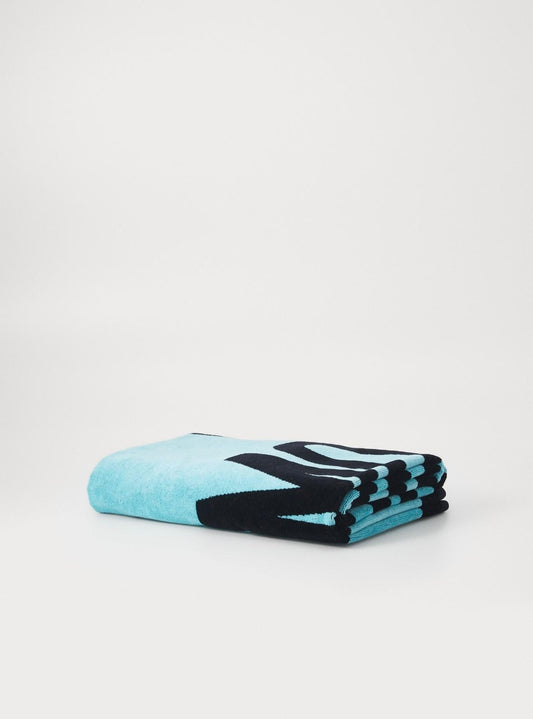 Telo mare Moschino Beachwear con logo e grafica a contrasto