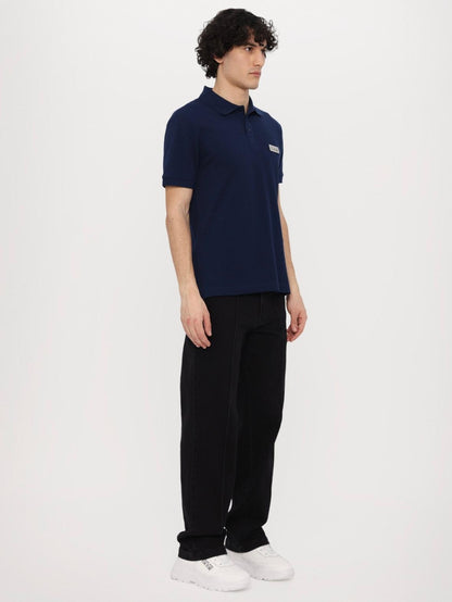 Polo Versace Jeans Couture in pique con logo in metallo uomo