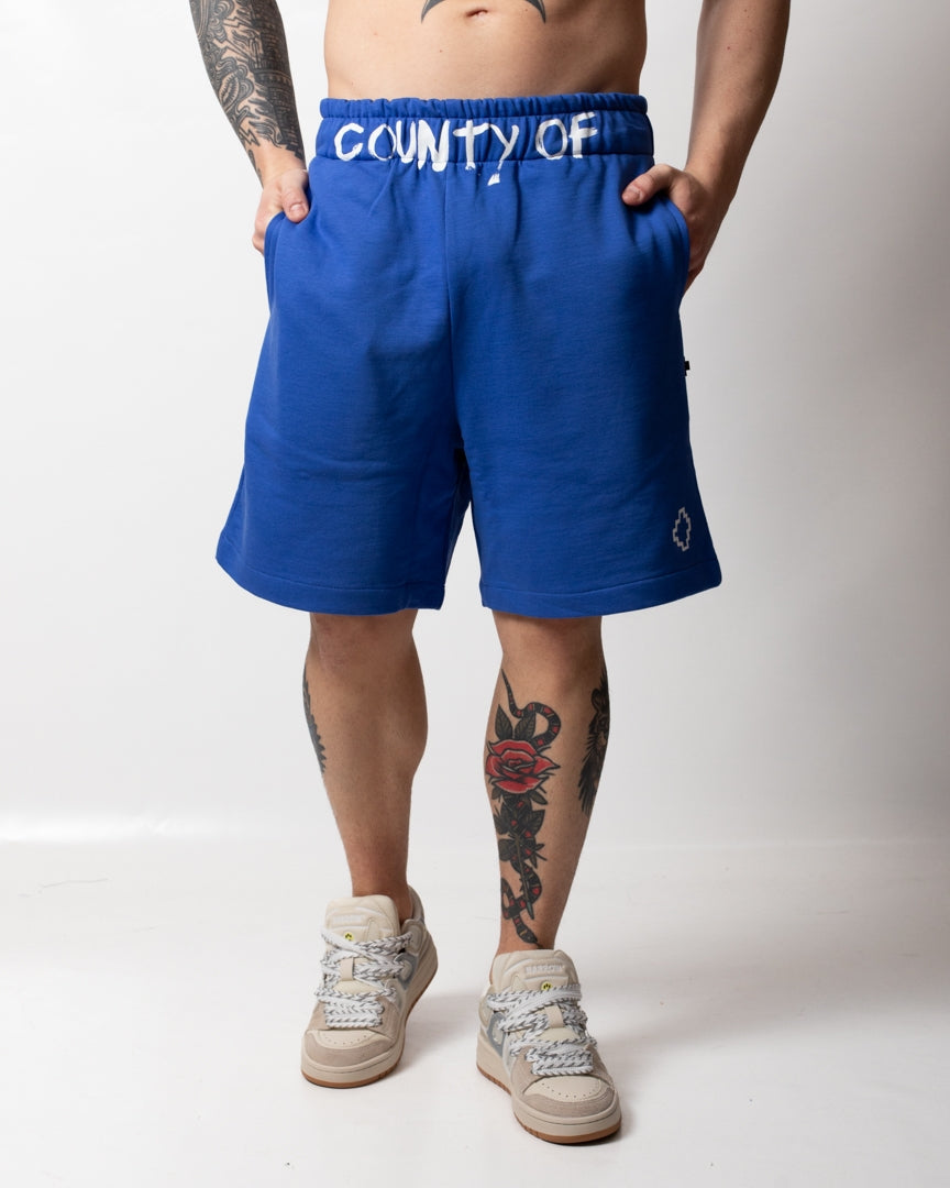 Bermuda Marcelo Burlon in felpa con logo "County" uomo
