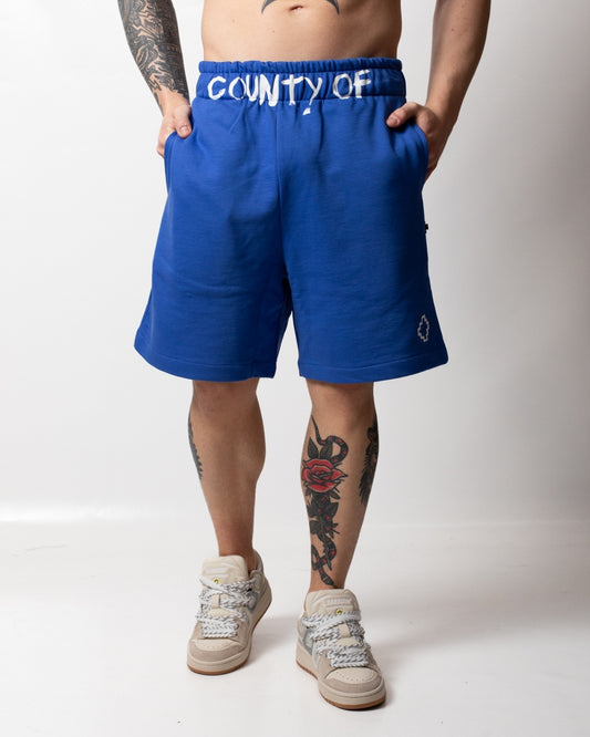 Bermuda Marcelo Burlon in felpa con logo "County" uomo
