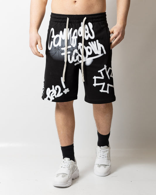 Bermuda Comme des Fuckdown in felpa con stampa spray uomo