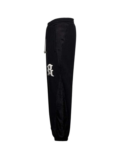 Pantalone John Richmond in felpa con ricamo e dettagli jacquard uomo