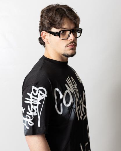 T-Shirt Comme des Fuckdown con stampa spray uomo