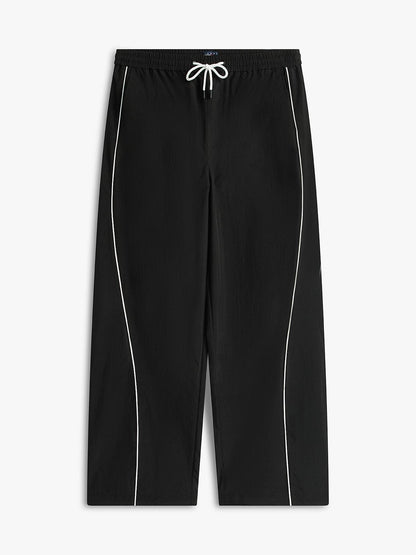 Pantalone Tommy Jeans in nylon "Parachute Track" uomo
