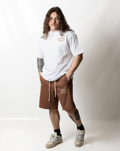 Bermuda Comme des Fuckdown in felpa con tagli e logo uomo