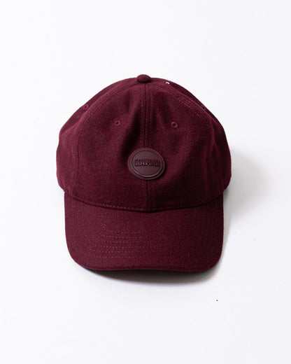 Cappello Colmar in lana con visiera e logo in rilievo