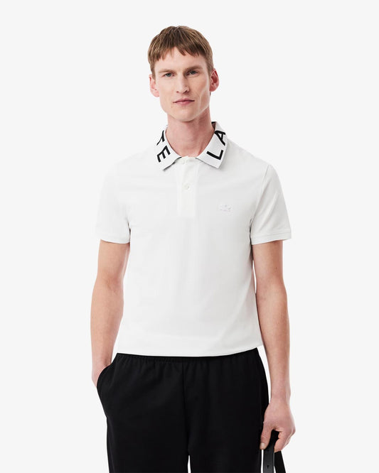 Polo Lacoste con logo sul colletto a contrasto jacquard