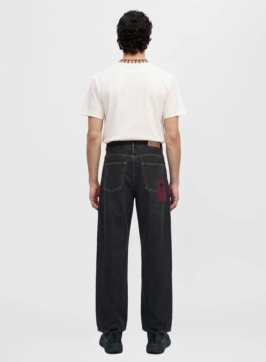 Jeans Palm Angels baggy fit con stampa e patch logo