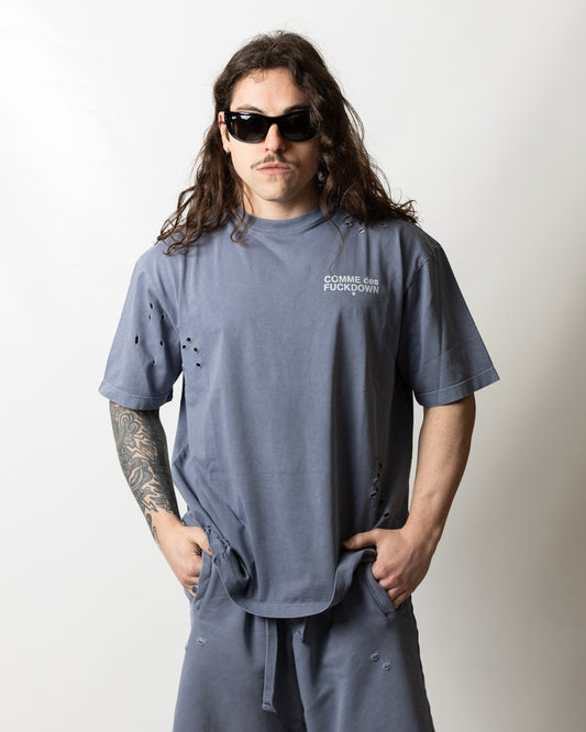 T-Shirt Comme des Fuckdown logata con strappi uomo