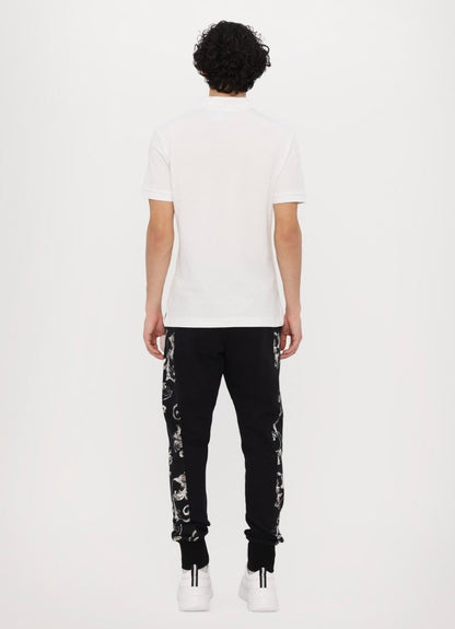 Polo Versace Jeans Couture in pique con logo in metallo uomo
