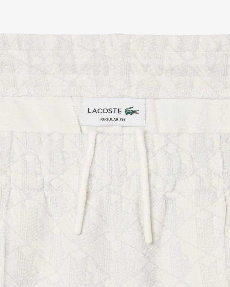 Pantalone Lacoste logato allover uomo