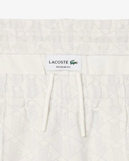 Pantalone Lacoste logato allover uomo