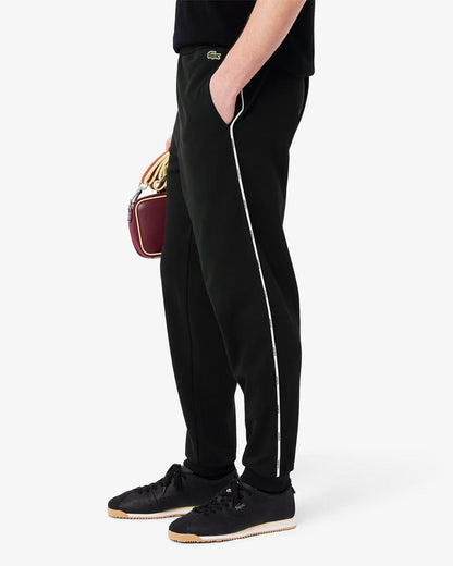 Pantalone Lacoste con logo firmato lungo la gamba uomo