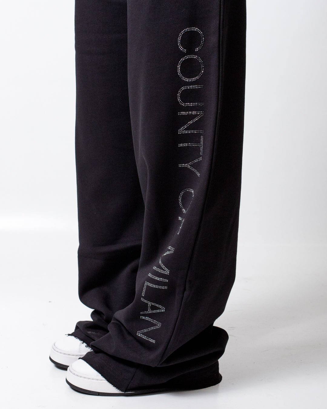 Pantalone Marcelo Burlon in felpa a taglio vivo con strass donna