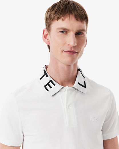 Polo Lacoste con logo sul colletto a contrasto jacquard