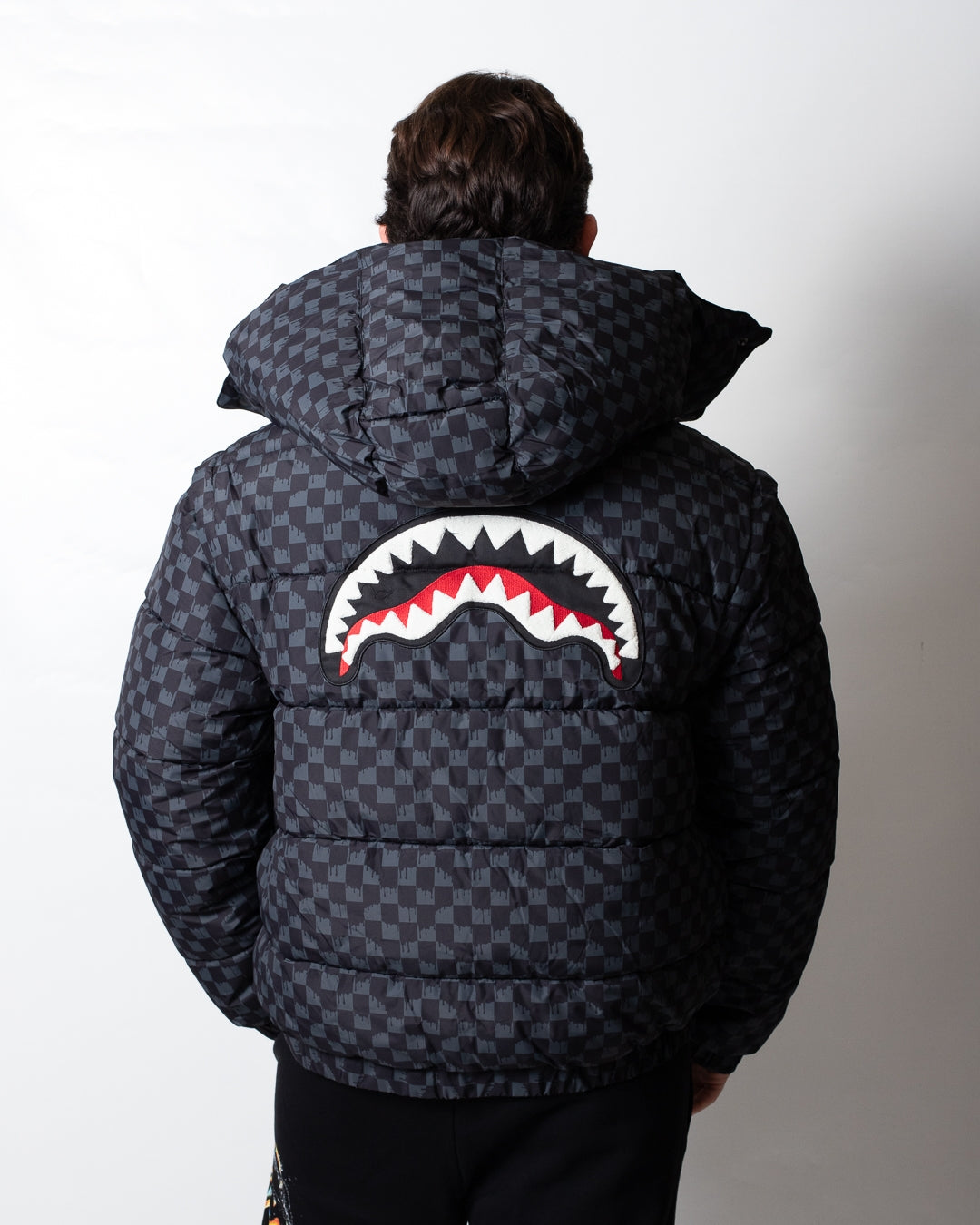 Giubbotto Sprayground puffer con cappuccio e maniche staccabili