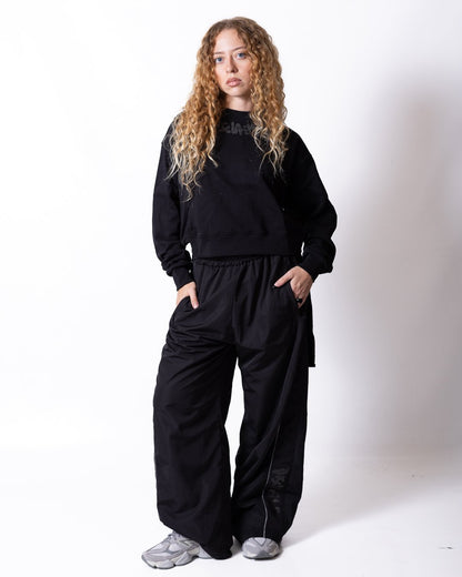 Pantalone Disclaimer con logo glitter e dettagli laminati